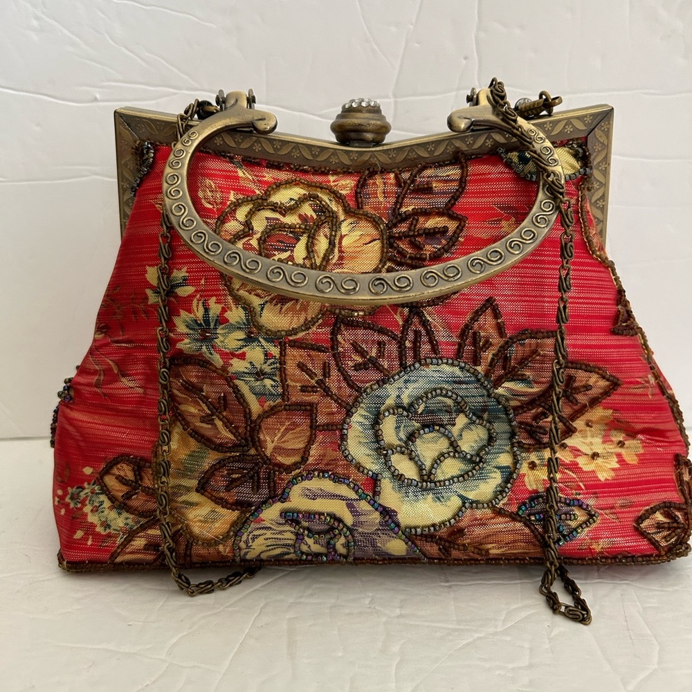 Vintage beaded clutch /evening bag with metal strap 
Nice beading